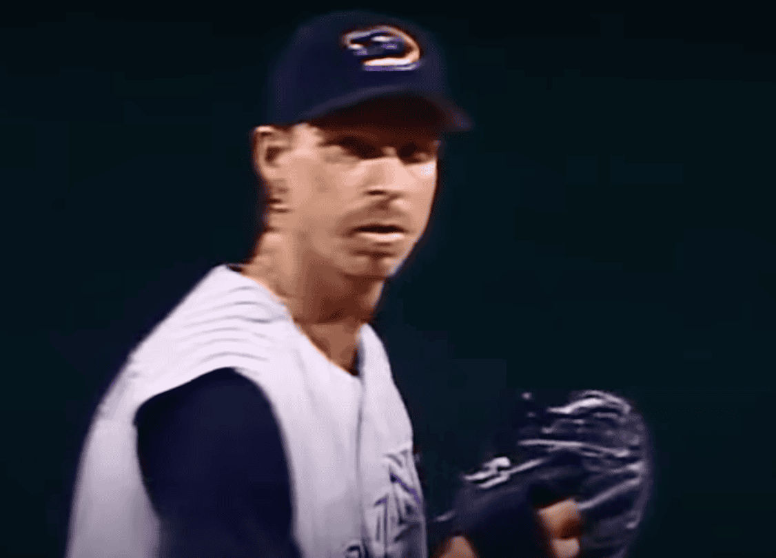 Randy Johnson delivering a perfect game at age 40, showcasing epic pitching mastery.